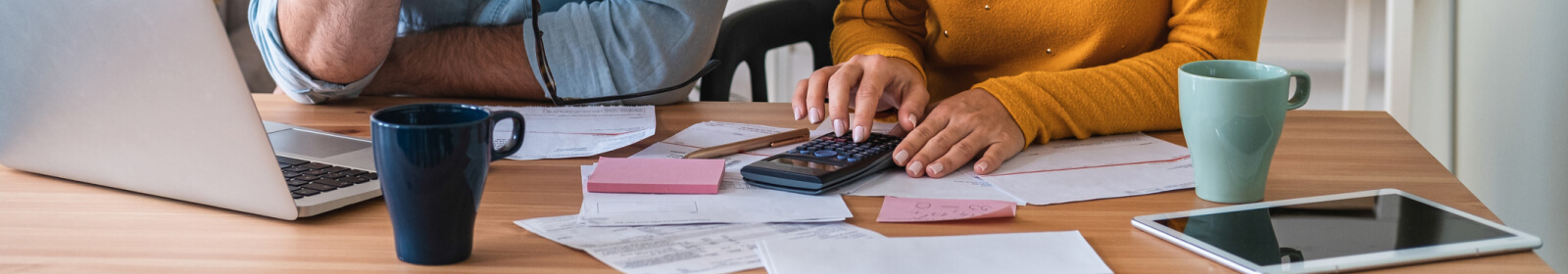 Two people calculating their finances