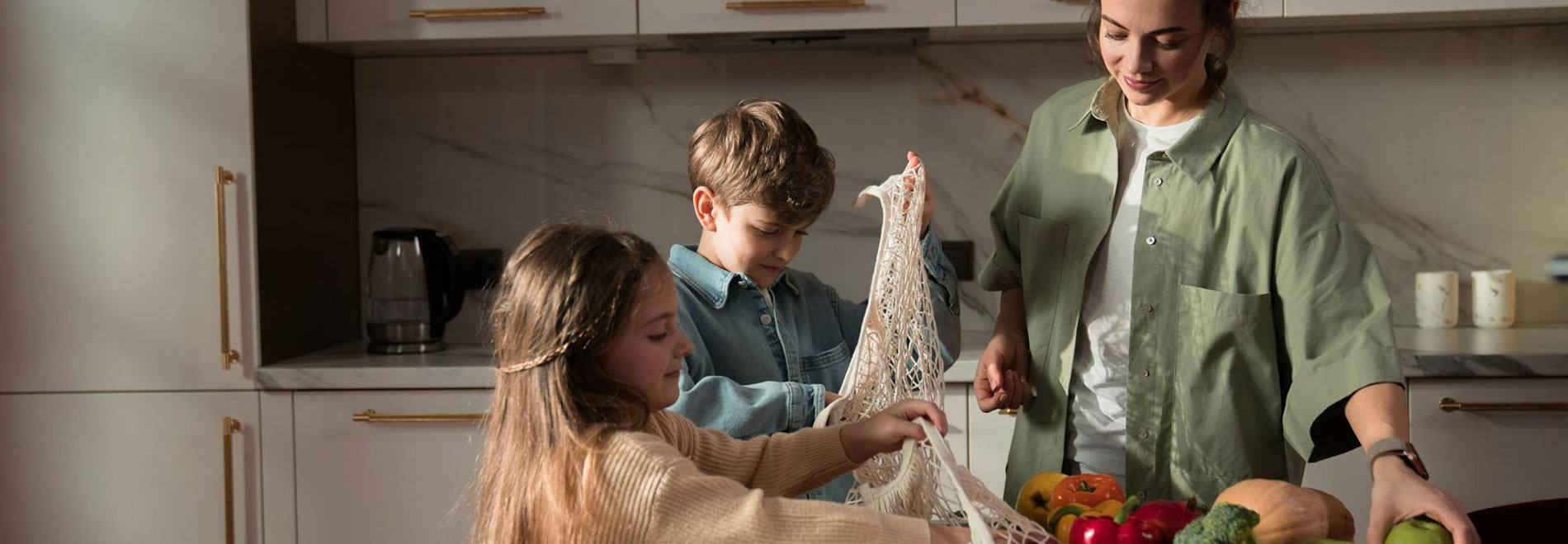 A mom and her kids in their kitchen